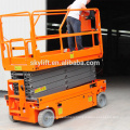 Electric powered self propelled scissor lift table